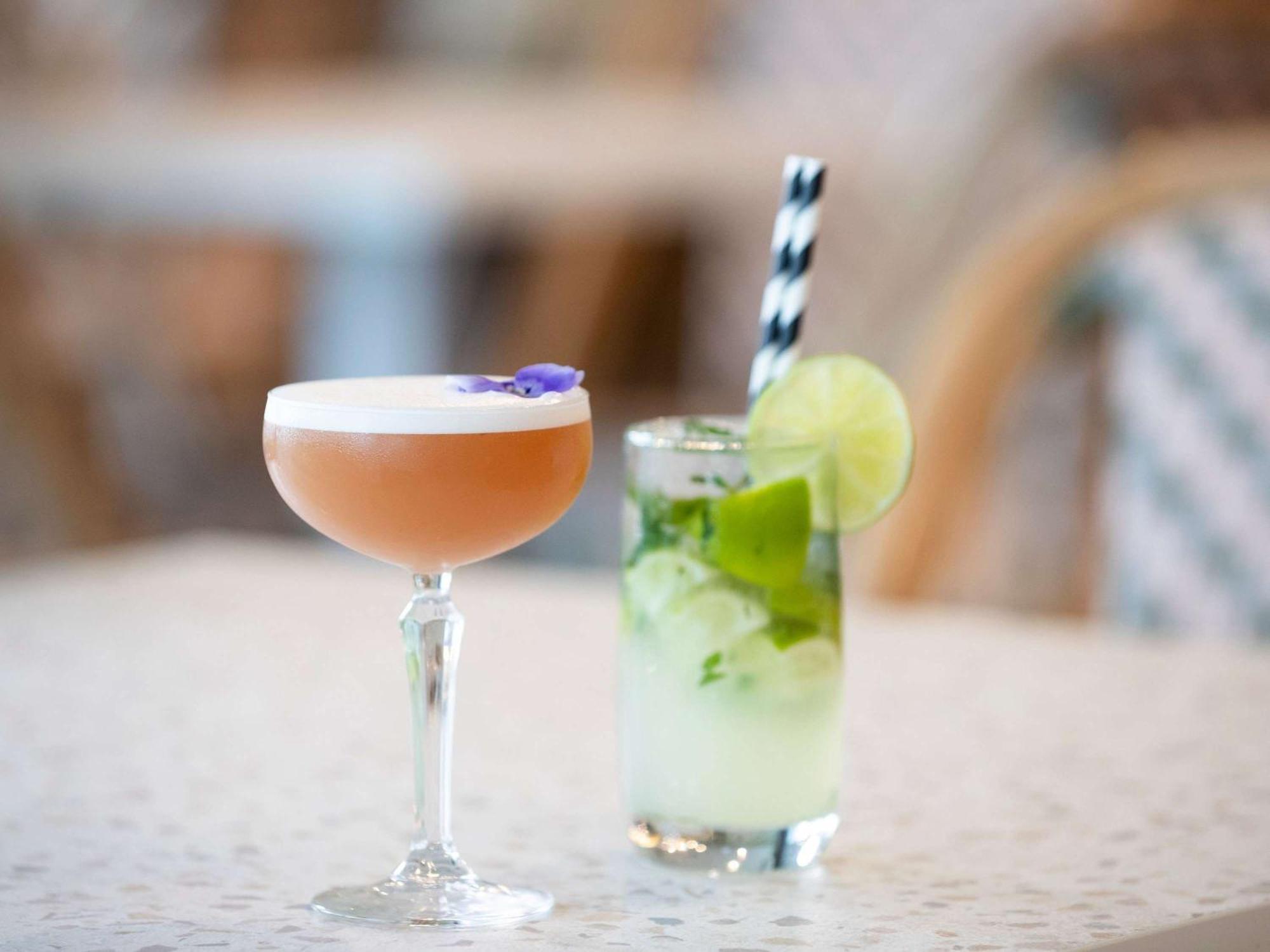 Pullman Magenta Shores Resort Entrance Exterior photo A Clover Club (left) and a Mint Julep (right)
